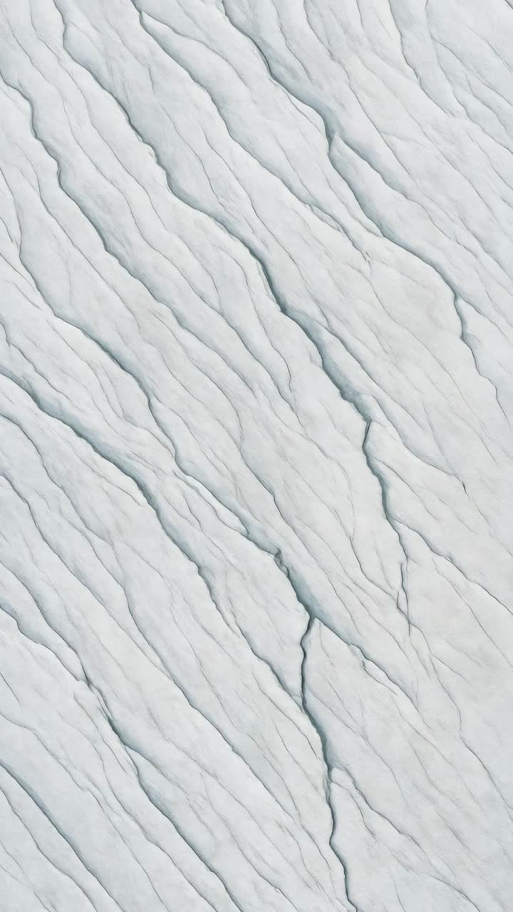Aerial view of cracked ice surface, showcasing intricate patterns