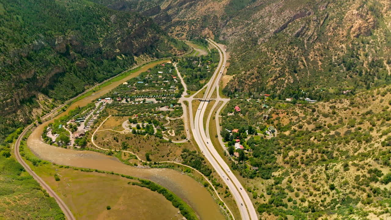 Delightful scenery of resort town in the mountains. Beautiful town locating between the river and speed highways. Top view.