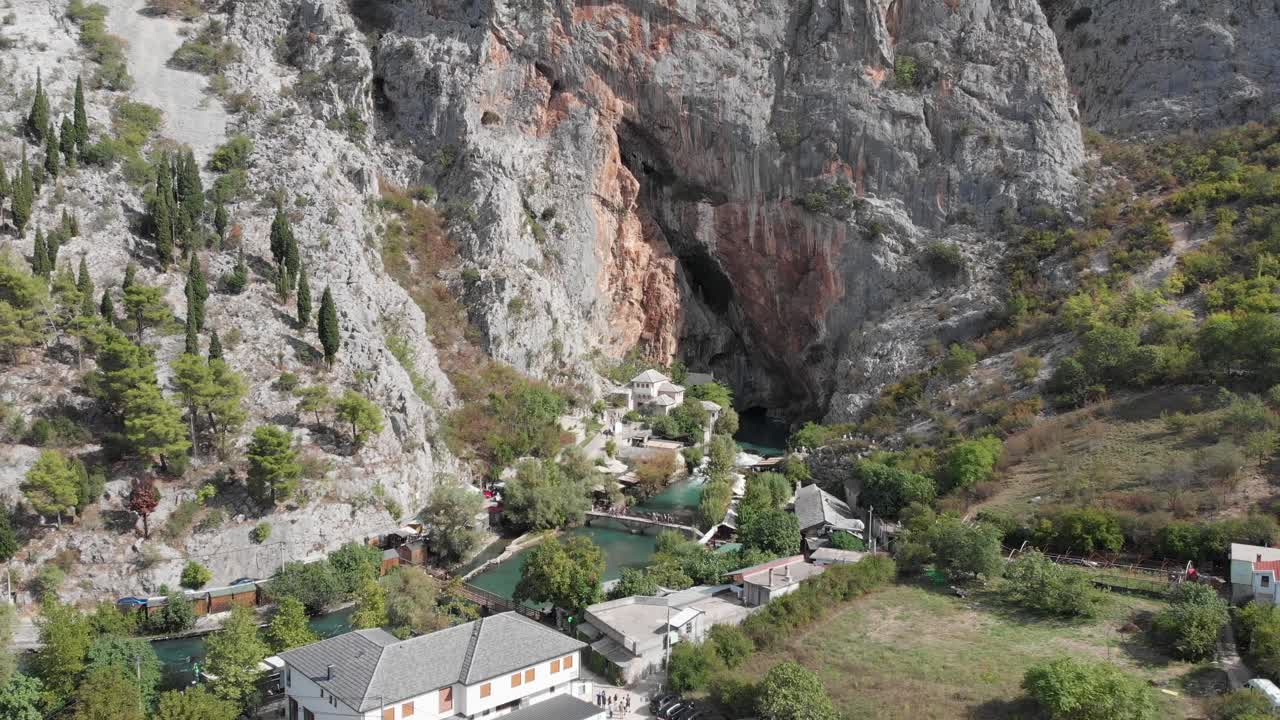 Aerial: Blagaj in Bosnia and Hercegovina. Flying backwards
