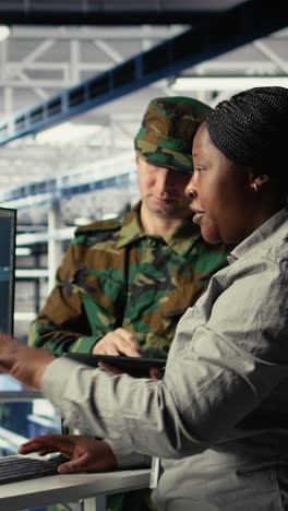 Vertical Video Military Staff In Server Room Uses Ai Tools To Help Manage Computer Systems