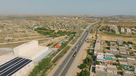 aerial view of highway and cityscape in pakistan