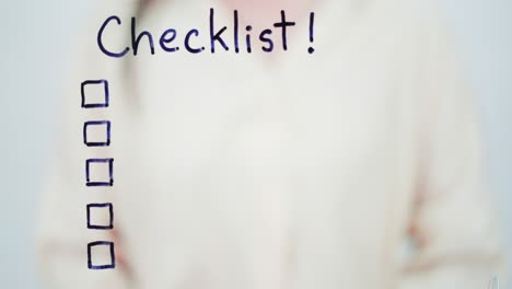 business woman writing plan checklist on glass board in office.