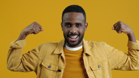 happy man showing muscles