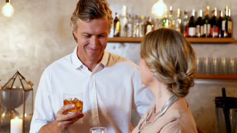 happy couple standing near bar counter toasting a glass 4k 4k