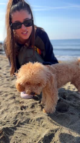 girl and her dog on the beach