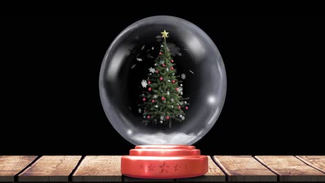 Animation-of-christmas-snow-globe-with-christmas-tree-and-snow-falling-on-black-background