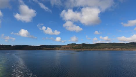 View-of-the-coast-of-a-wide-island-in-Scotland,-view-from-the-ferry