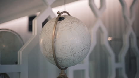 vintage globe on an elegant interior shelf