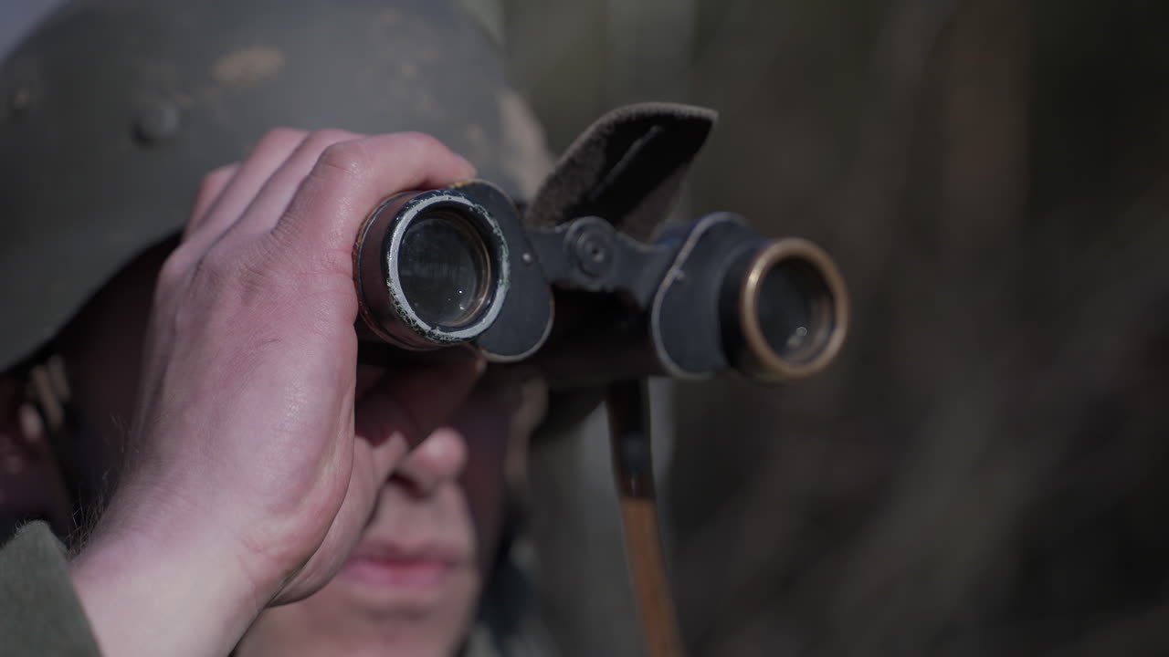 Soldier using binoculars