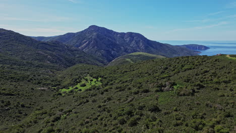 aerial view of corsicas mountain range and distant lake