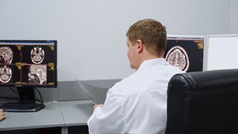 doctor reviewing brain scan images