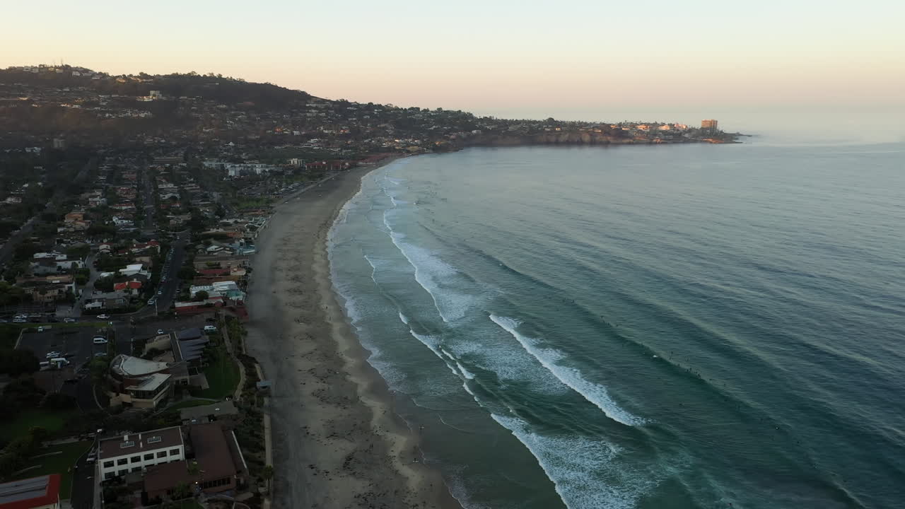 Waves From Pacific Ocean Washing Up On Sandy Beach In La Jolla After Sunrise In San Diego, Califonia