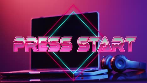 animation of press start text over laptop video game equipment on neon background