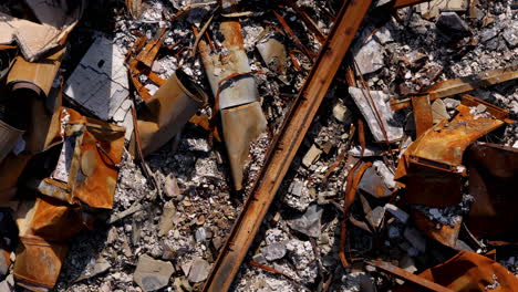 aerial view of rusted metal and rubble from a demolished site