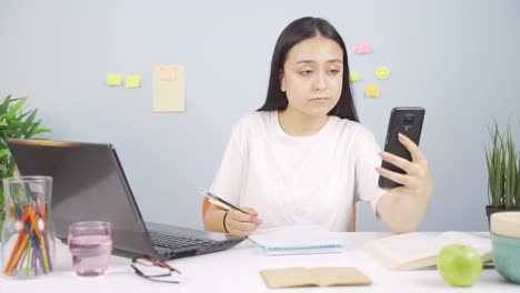 female student video calling about lessons.