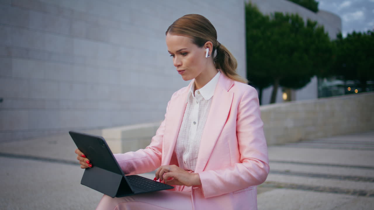 Business woman talking video conference sitting street bench with laptop closeup