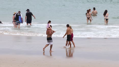 people enjoying and playing at the beach