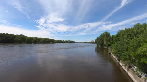 timelapse view of river trees and beautiful blue sky and clouds, in natural park, beautiful summer weather