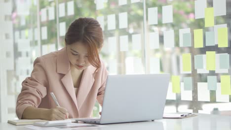 a young woman working with a laptop in a coffee shop business idea financial girl accountant