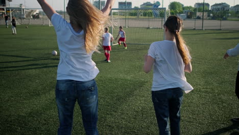 excited fans celebrating soccer match