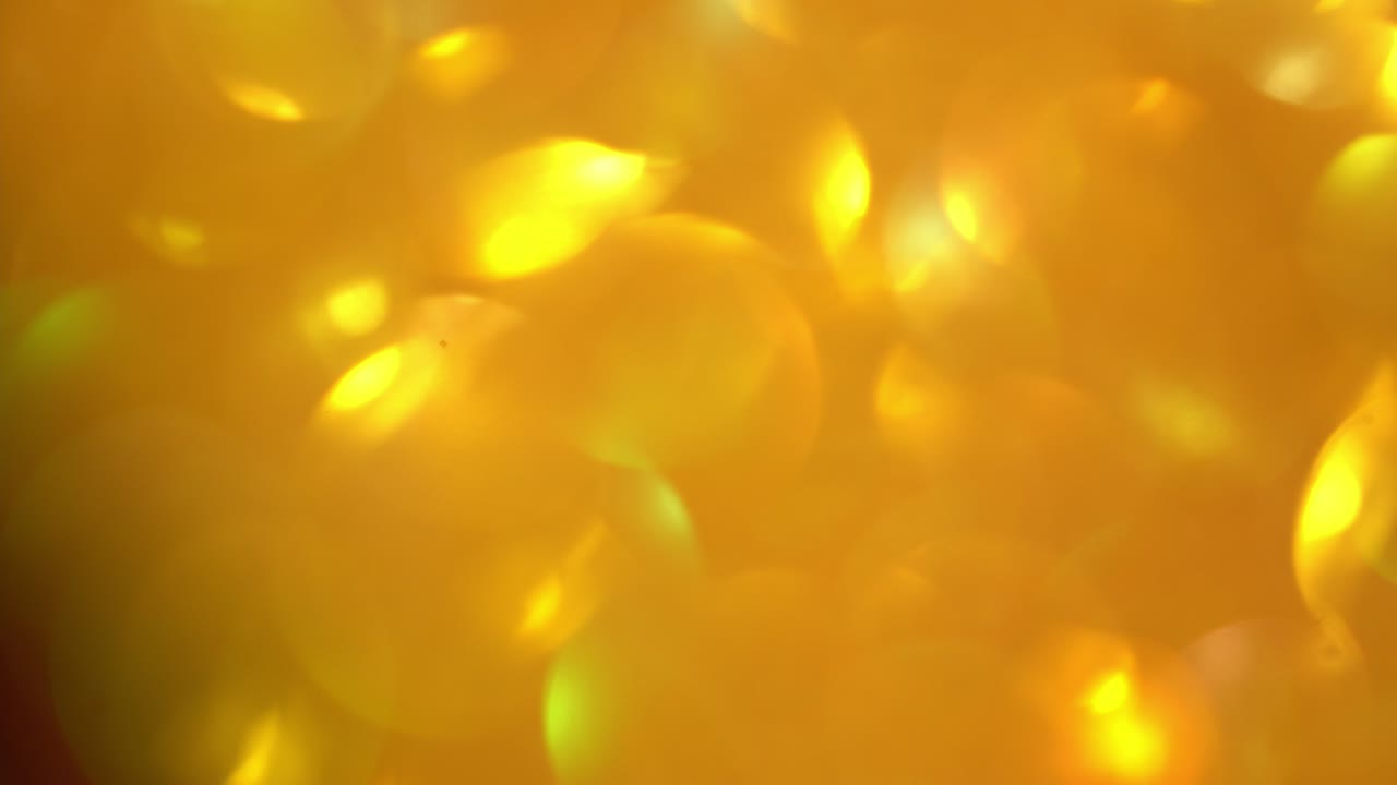 박이는 배경의 빠른 움직임, 황금빛 빛의 흐릿한 질감, 노란색 금색 니로 매이지 않는 질감