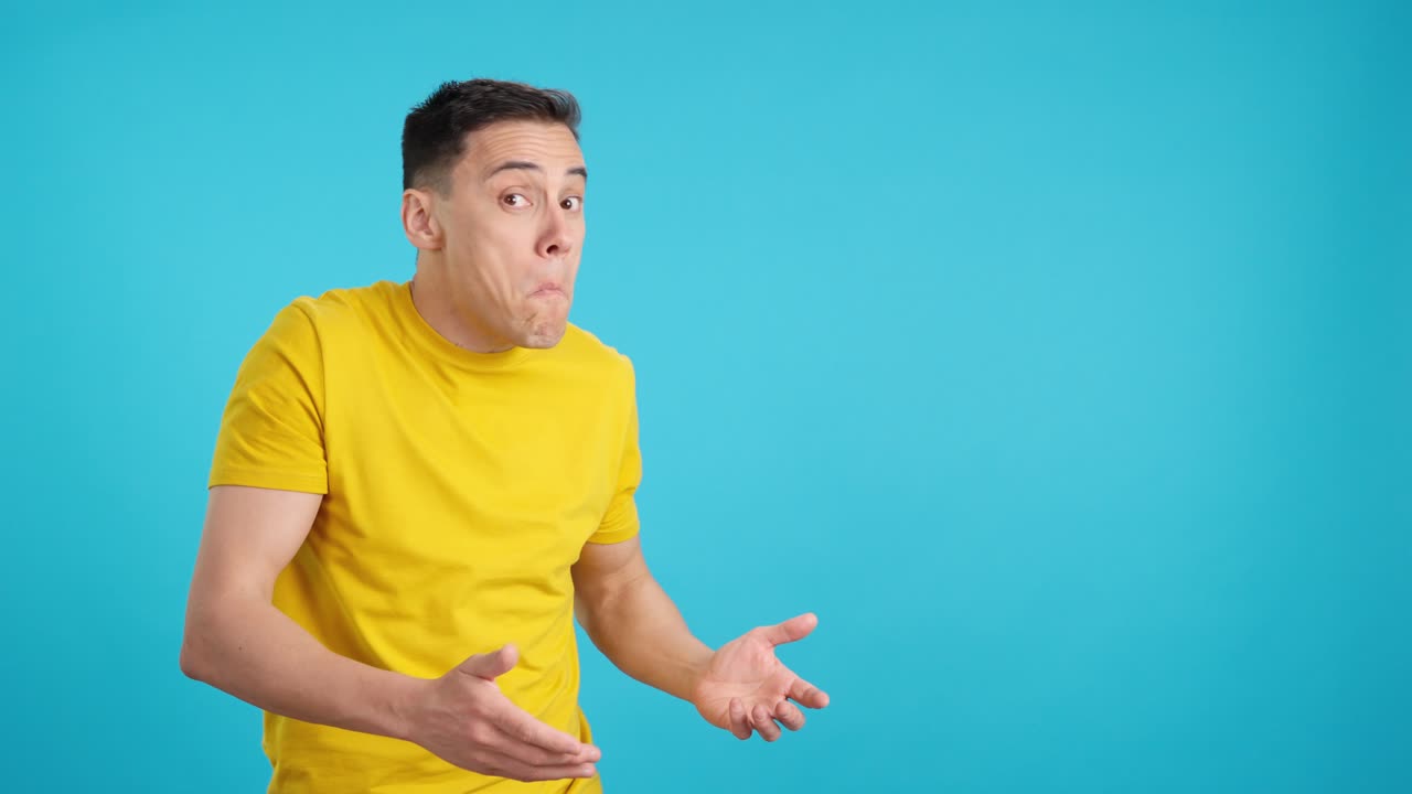 Man expressing confusion in front of a blue background