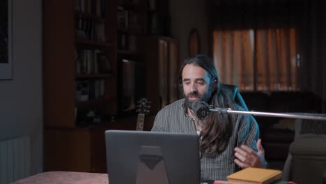 man recording podcast/video at home