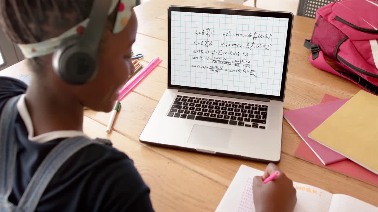 Composition of african american schoolgirl on laptop online learning with maths