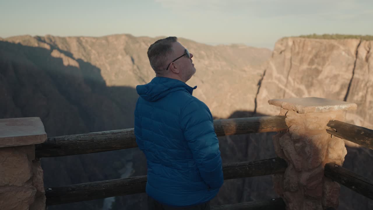 Man enjoying the view of a canyon