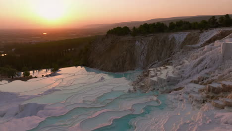 pamukkale travertine terraces and thermal pools at sunset