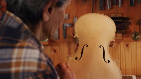 female luthier at work in her workshop