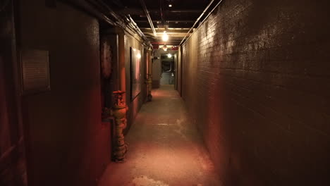 static interior shot of tunnel under a building with lights