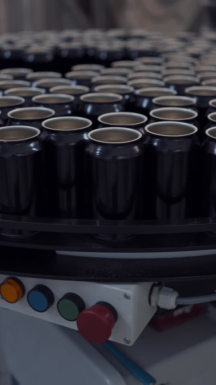 Black Aluminum Cans on a Production Line