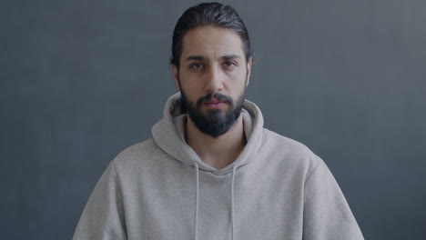 surprised man in a gray hoodie