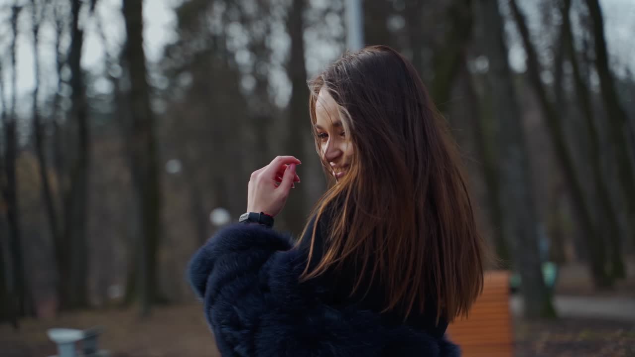 Beautiful woman outdoors. Beautiful young woman posing in park
