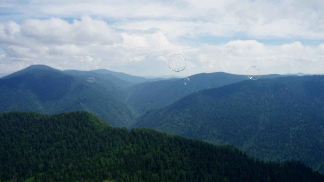 Mountain Scenery with Soap Bubbles