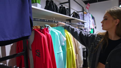 woman shopping for clothes in a store