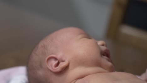 Baby-Is-Crying-While-Her-Mother-Applying-Moisturizer-After-A-Quick-Bath