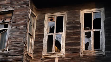 old wooden house with broken windows