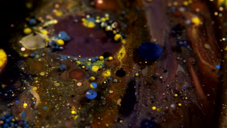 abstract colorful acrylic and food paint bubbles on water