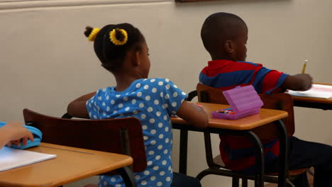 cute schoolchildren in the classroom