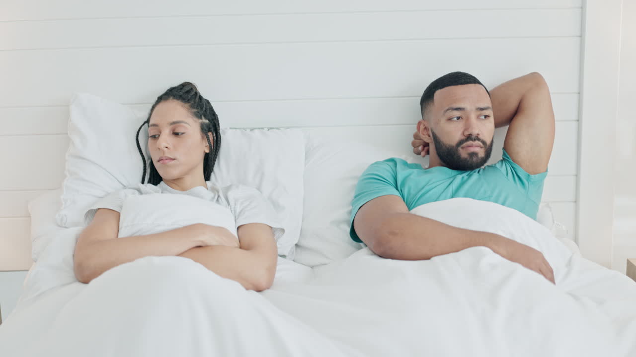 Fighting, divorce and upset couple in the bed