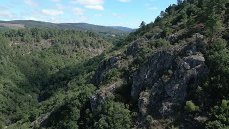 forested rocky mountain with rio toxa in silleda, pontevedra, spain