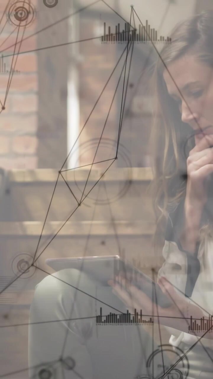 Vertical video: Woman tapping tablet in lounge, activating network overlay for data insights