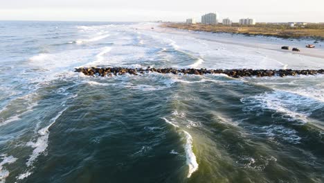 Drone-revealing-shot-of-New-Smyrna-Beach,-Shark-Capital-of-the-World