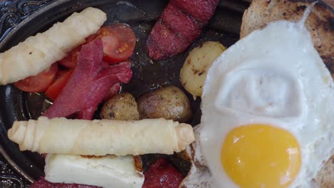 turkish breakfast platter with fried egg and sausage