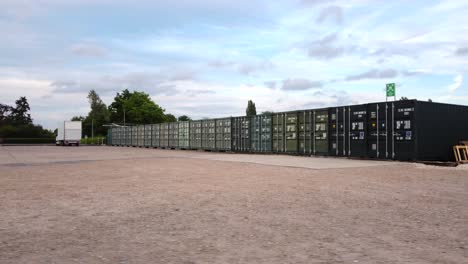 long line of storage shipping containers on industrial business park