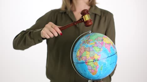 global justice and law: gavel over earth globe