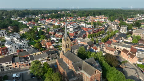 lummen village and church in limburg, belgium - aerial view sunny day