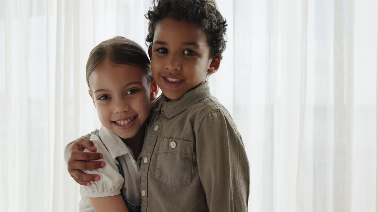 Children, face and siblings hug in a house